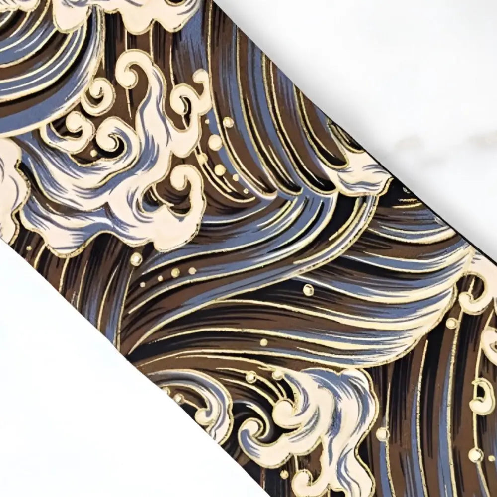 Japanese wave pattern on fabric wallet and obi belt accessory showcasing traditional design