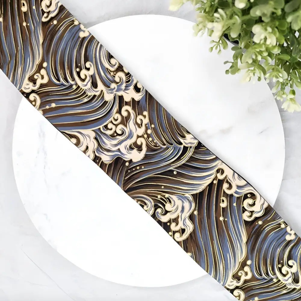 Japanese wave patterned ribbon featured as an obi belt accessory in traditional fabric design