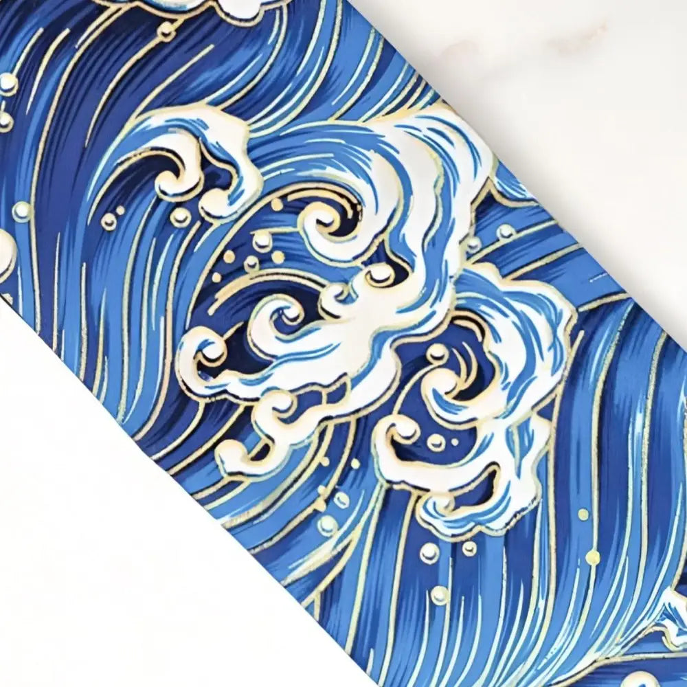 Blue and white Japanese wave design on obi belt and luggage tag with wave pattern