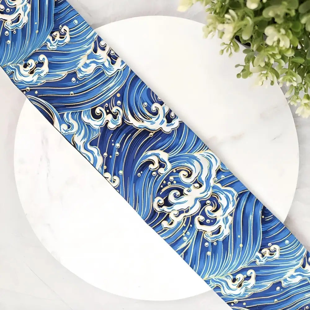 Blue wave patterned obi belt and luggage tag with traditional Japanese wave design