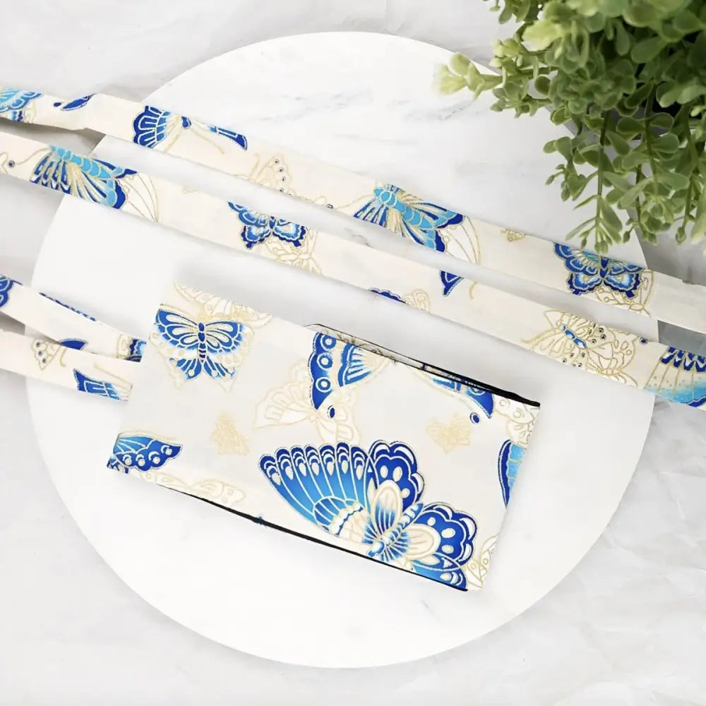 Butterfly-patterned fabric bag with straps, ideal as an obi belt accessory for elegant attire