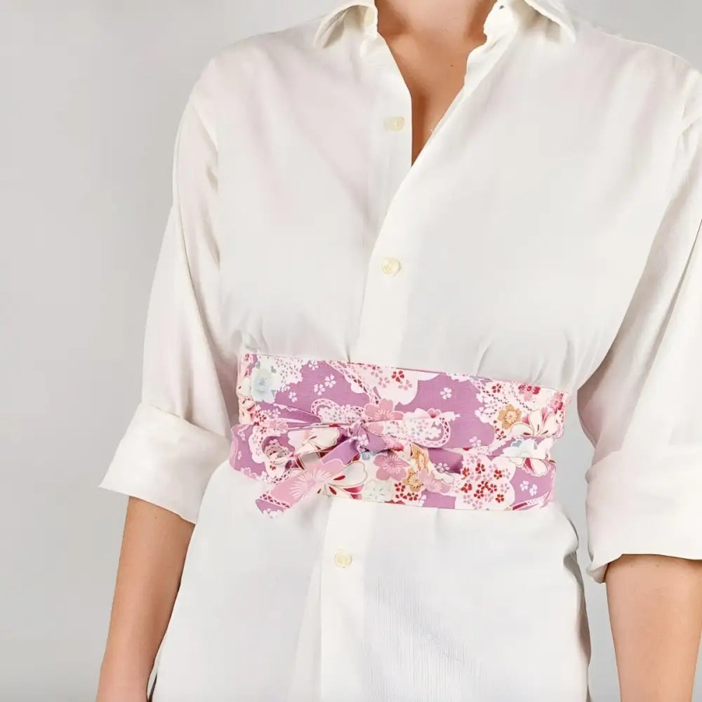 Elegant floral print purple obi belt displayed with a matching luggage tag