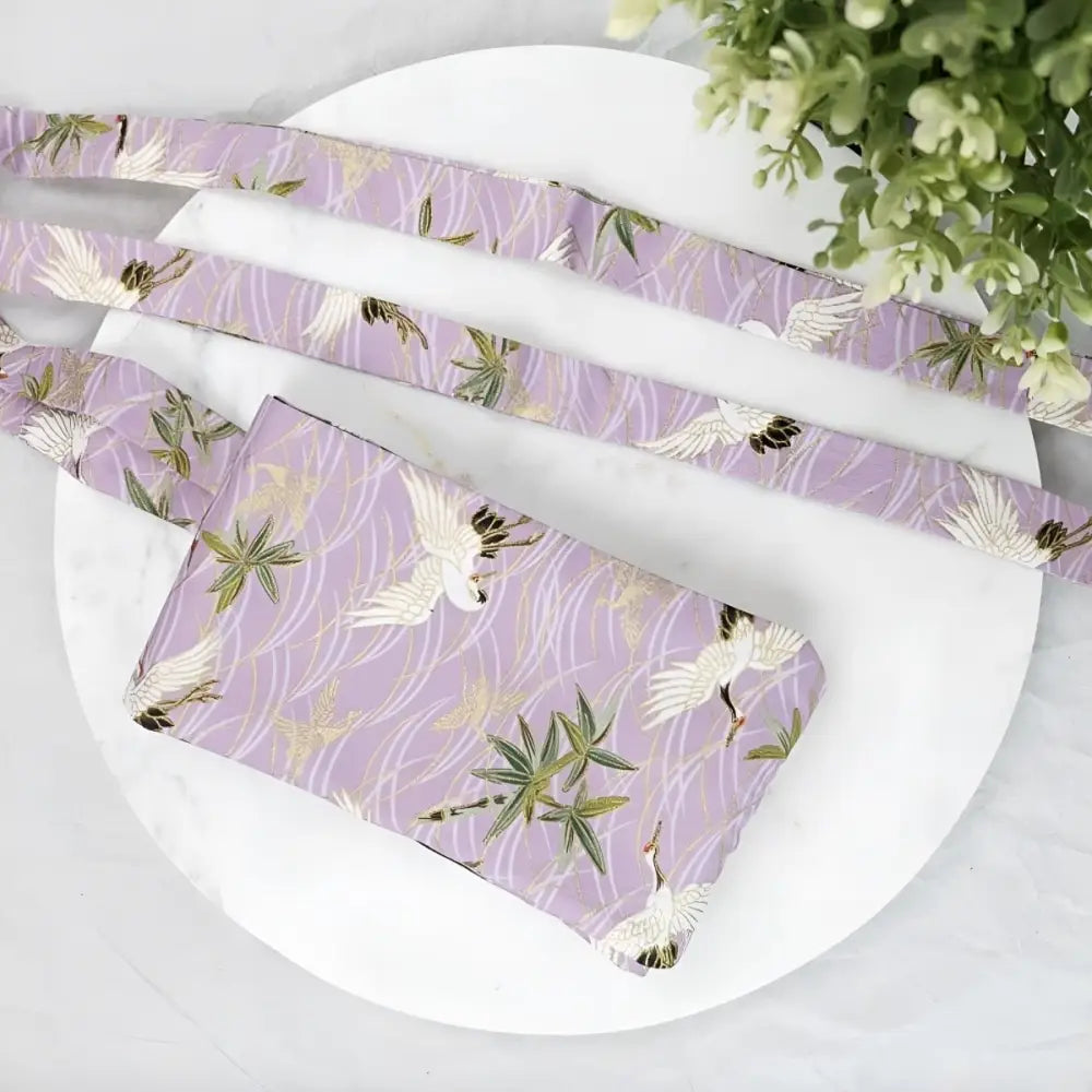 Lavender crane-patterned fabric set with floral obi belt for elegant traditional attire