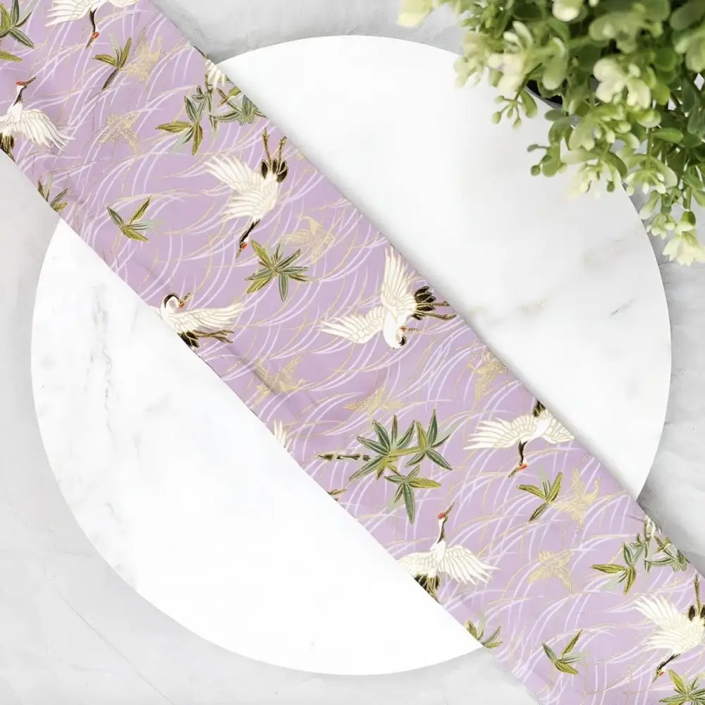 Lavender crane pattern fabric with floral obi belt for elegant traditional attire