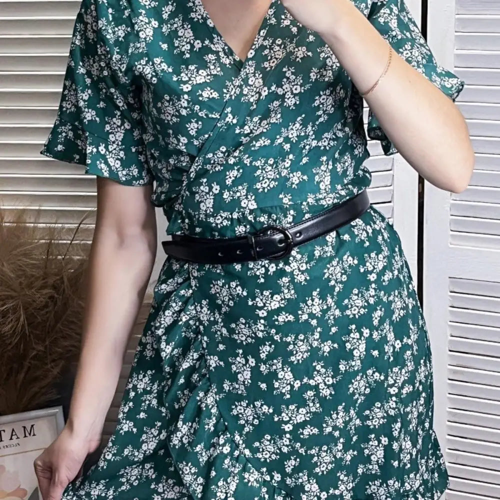 Green floral wrap dress with belt paired with Reversible Leather Belt featuring circular buckle