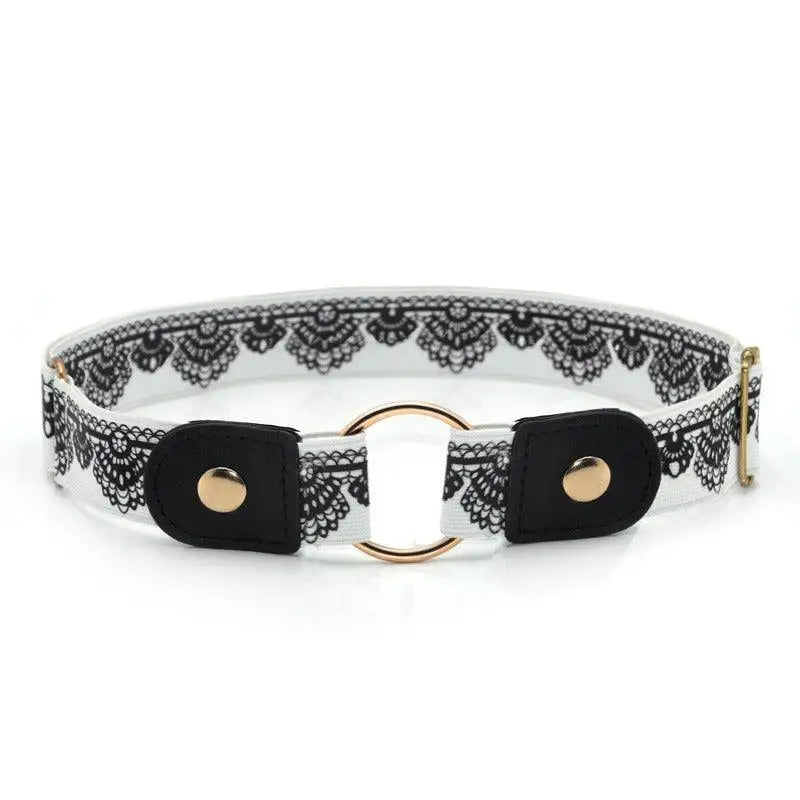 White and black lace belt with a gold ring accessory on Floral Dress with Black Belt and Gold Ring Detail