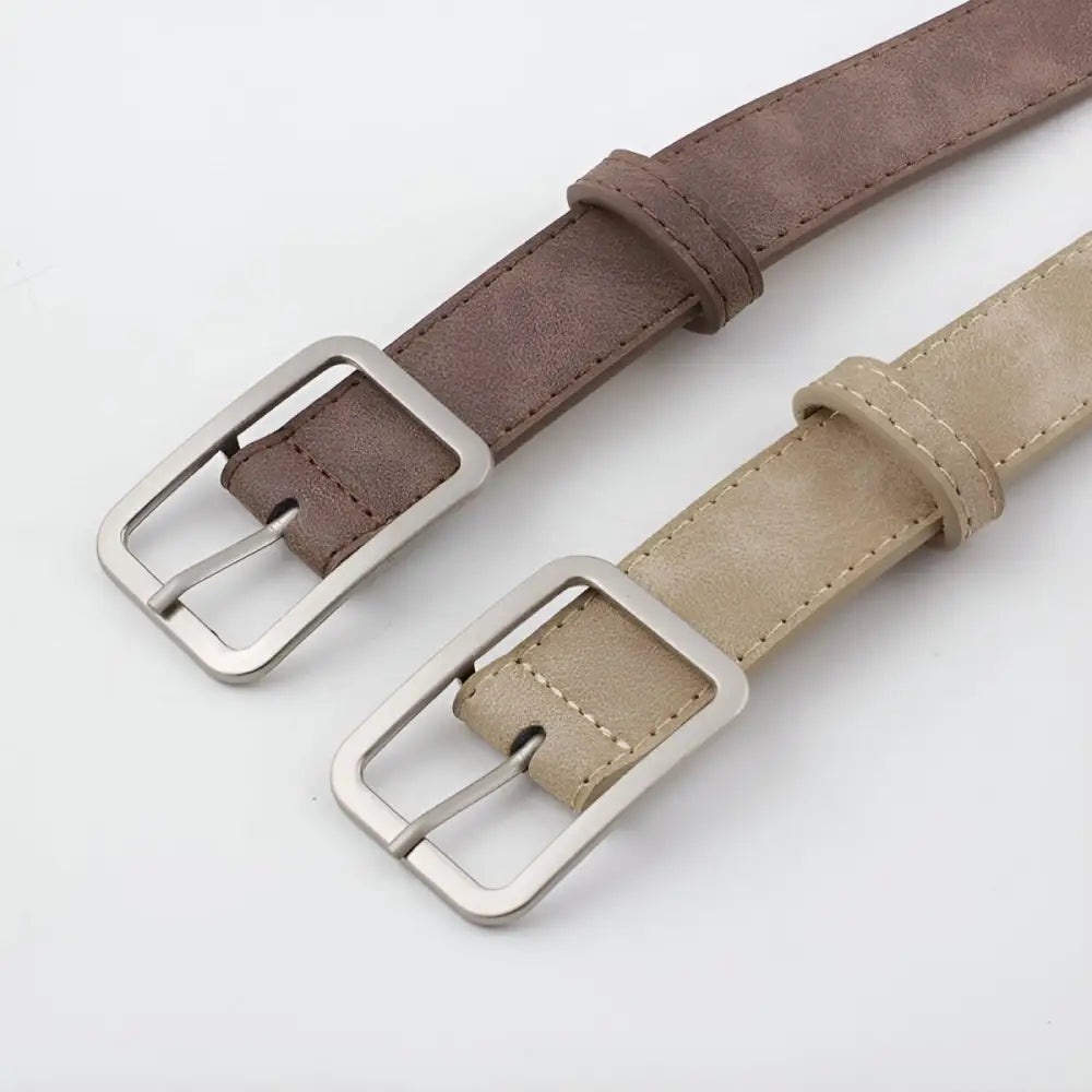 Assorted leather belts with silver buckles displayed in a product showcase