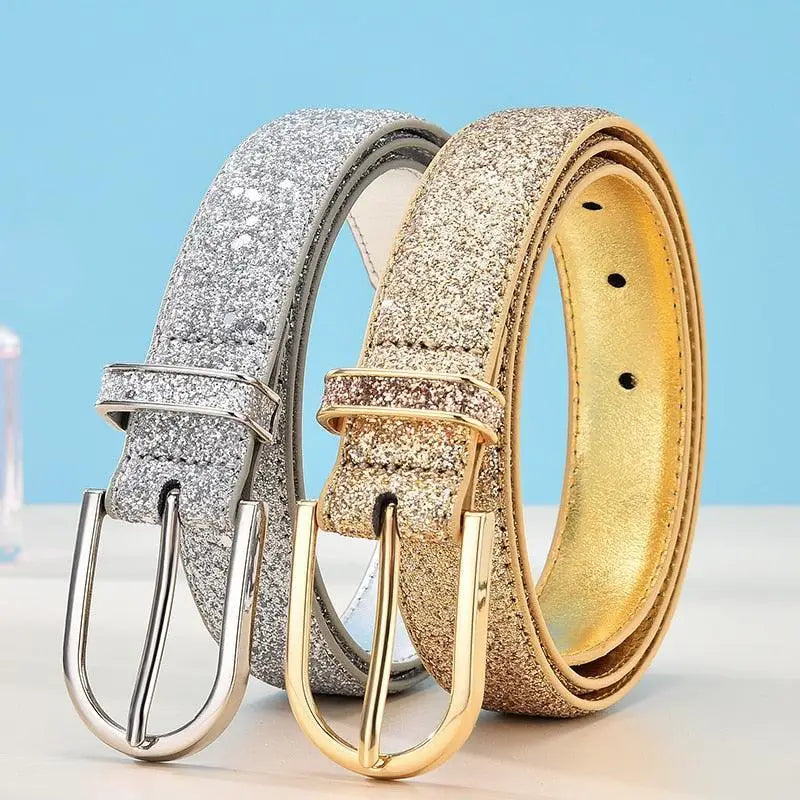 Sparkly silver and gold belts with gold buckle variations displayed prominently