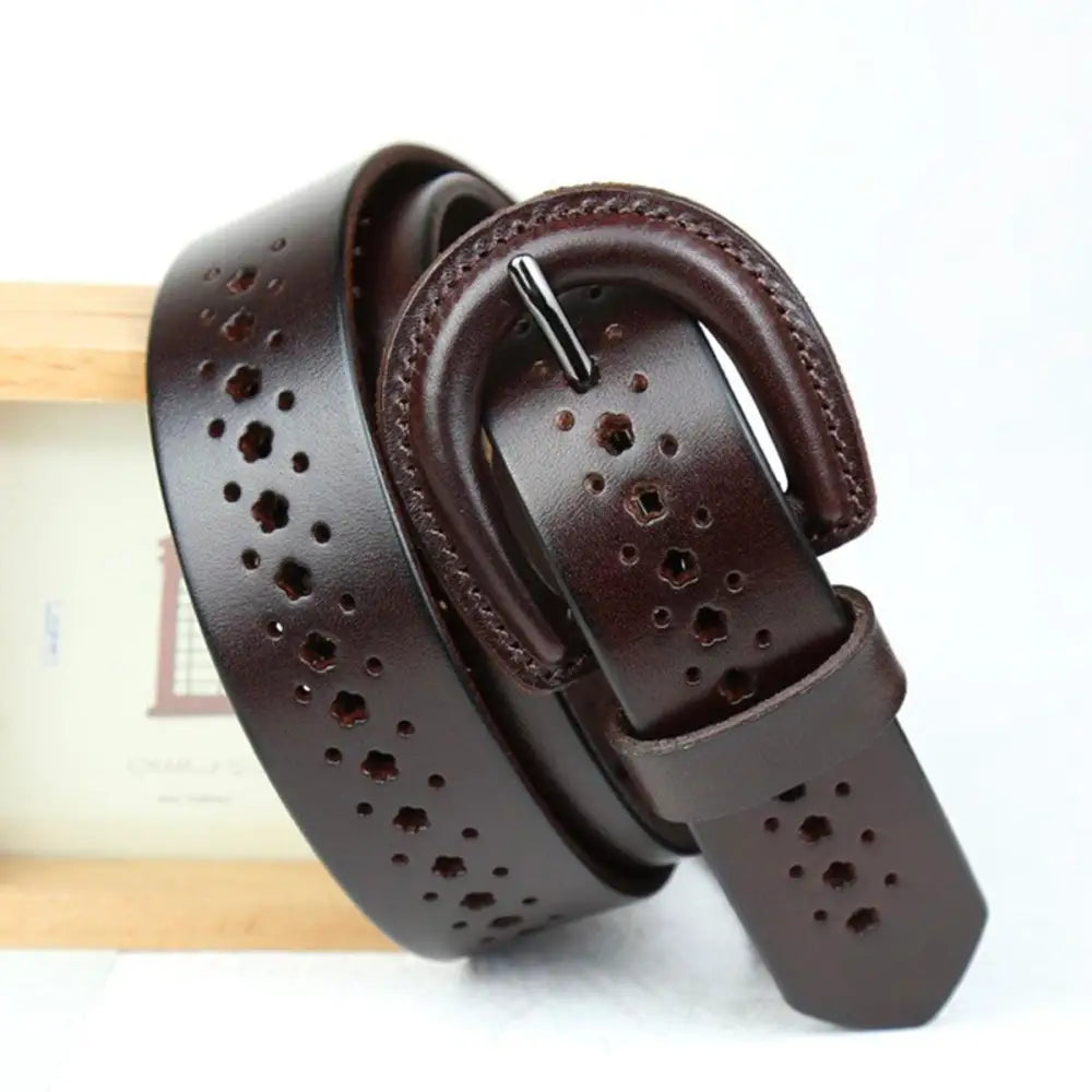 Mia Belt with circular cutouts and decorative perforations on brown leather strap