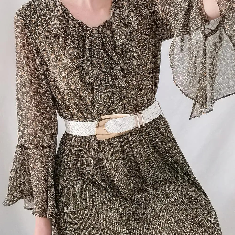 Patterned dress with ruffled collar and woven belt showcasing the Hezo Belt Collection in neutral tones
