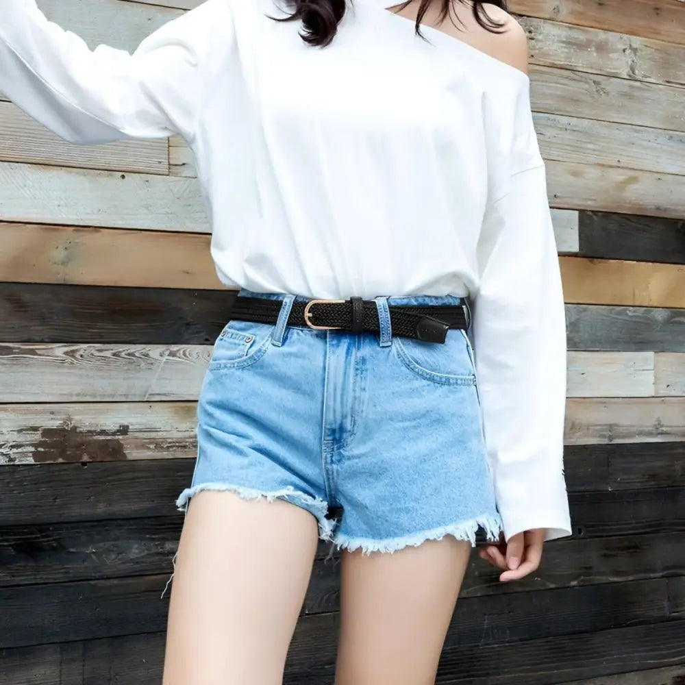 Woman’s denim shorts with black telica belt from the Elegant Telica Belt Collection