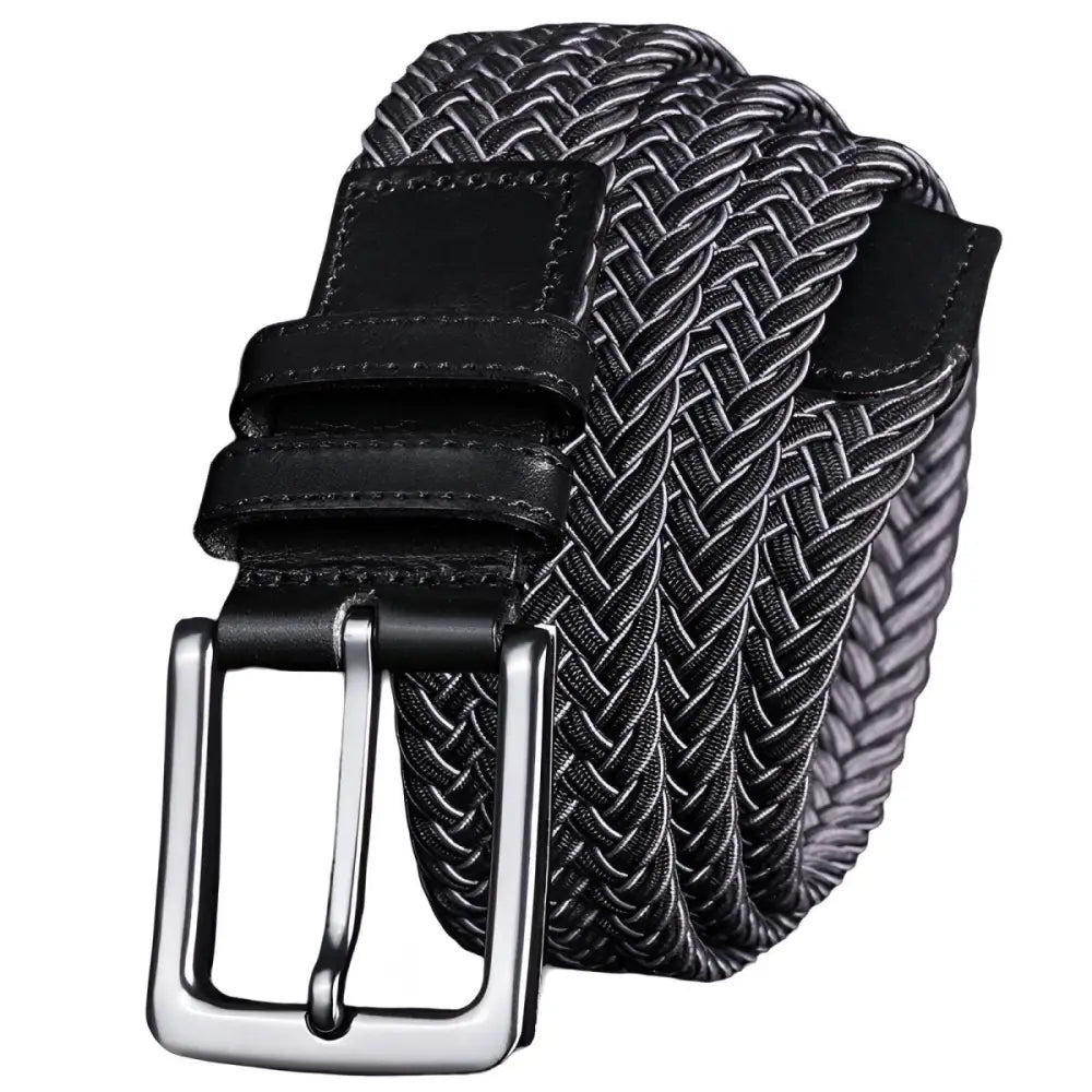 Green braided elastic belt with silver buckle and leather accents featuring a black and white braided belt