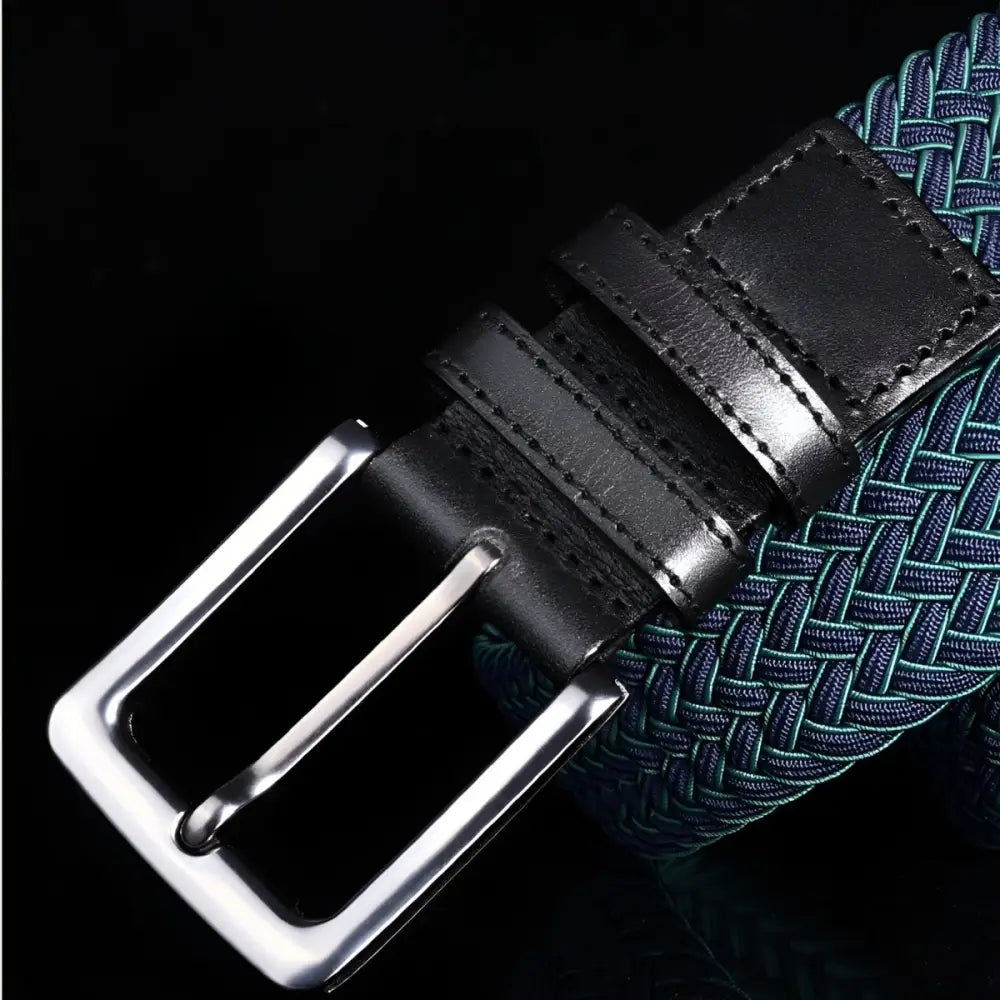 Green braided elastic belt with leather accents and a silver buckle for stylish wear