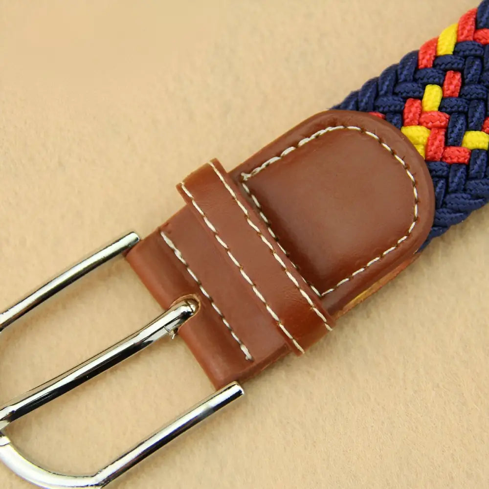 Braided elastic belt featuring leather accents and a metal buckle for stylish wear