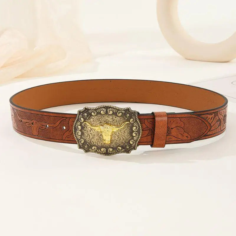 Brown leather belt featuring an ornate bull buckle for stylish Western attire