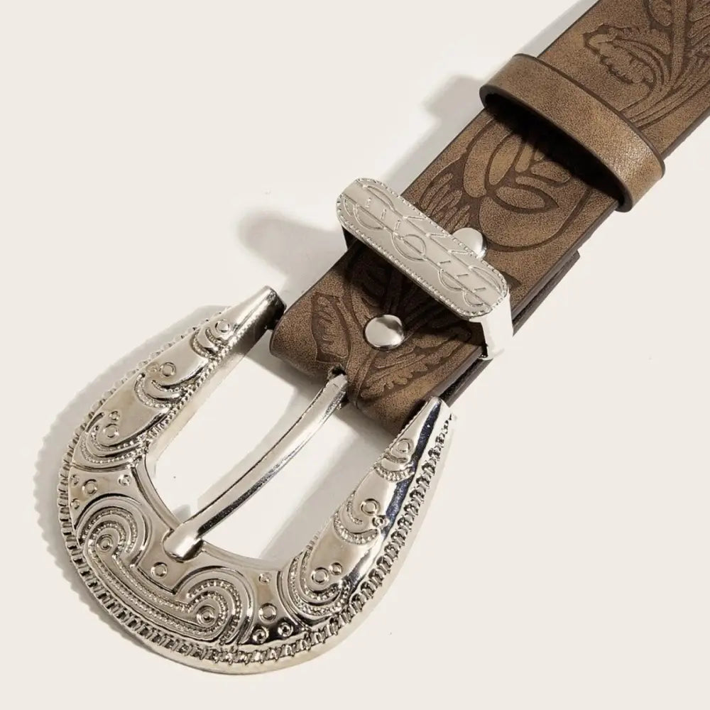 Brown leather belt featuring an ornate silver buckle for sophisticated style