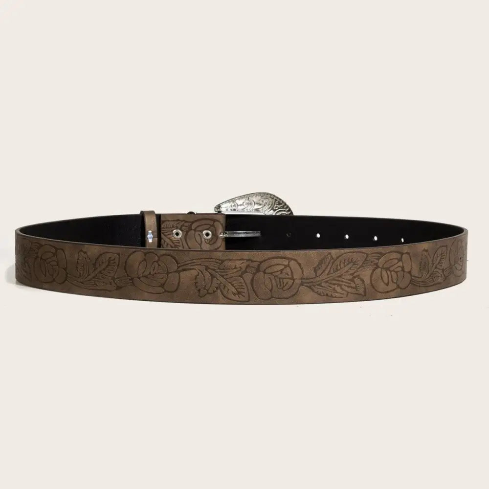 Brown leather belt with floral design and ornate silver buckle display