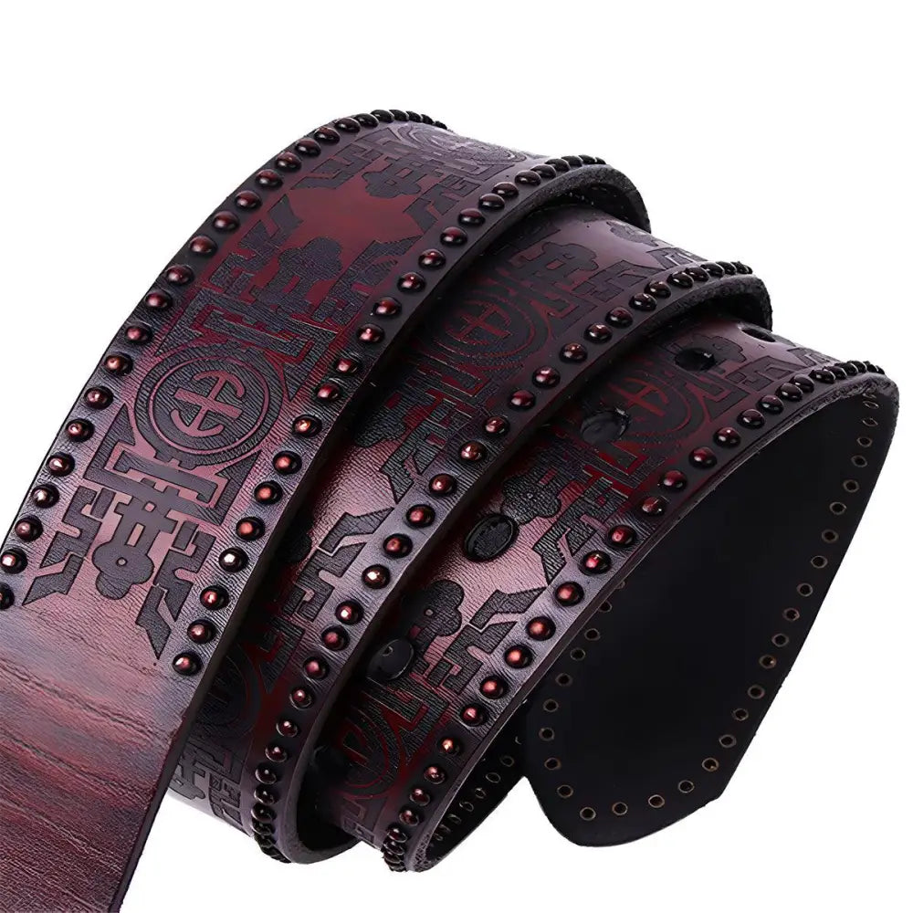 Studded burgundy leather belt with silver embossed buckle displayed on Maroon Leather Belt product