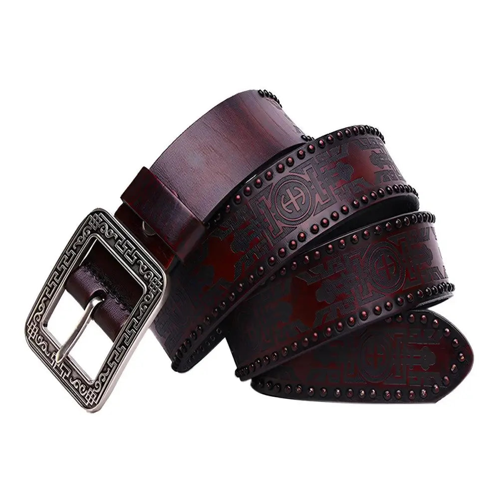 Maroon leather belt with a decorative silver embossed buckle for stylish wear