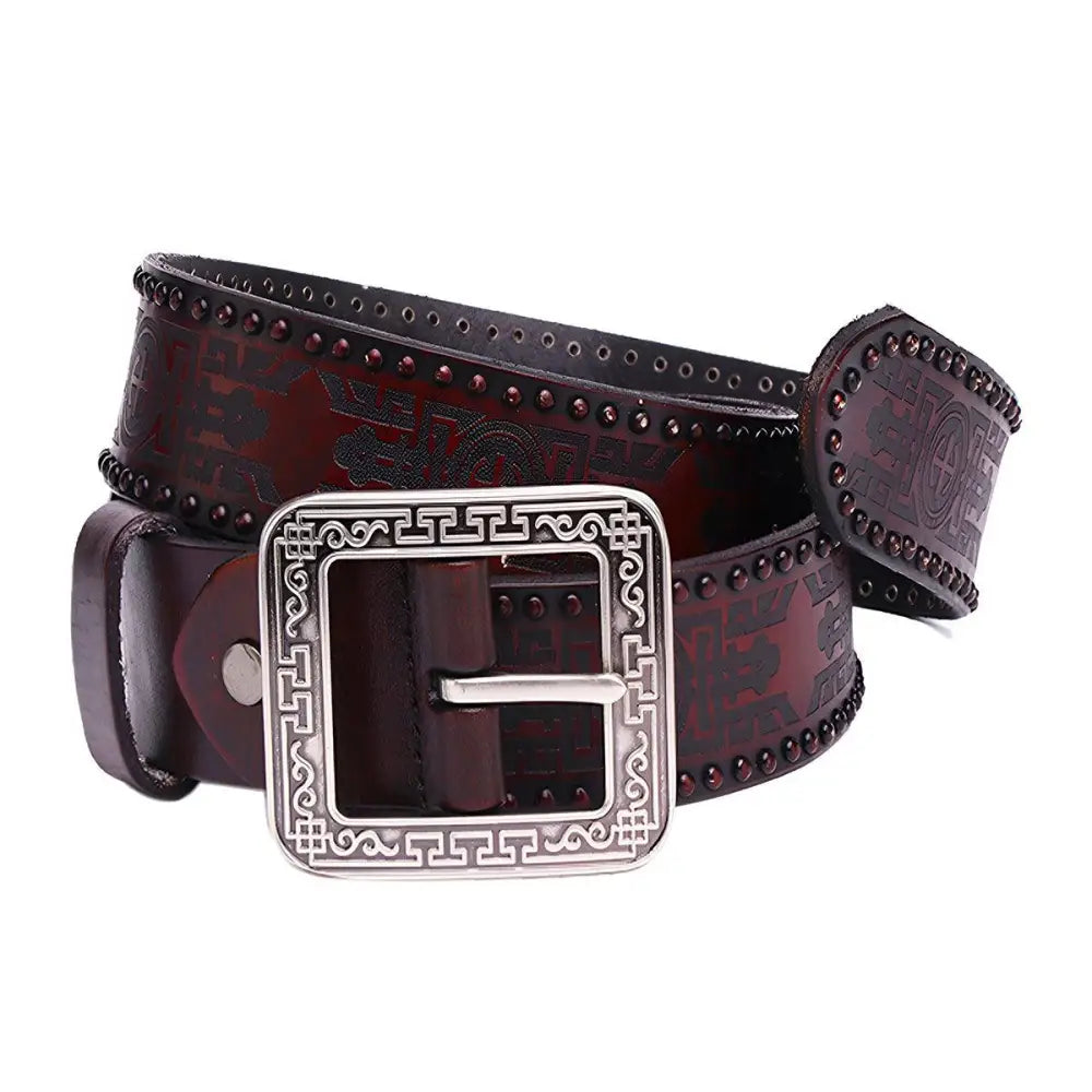 Maroon leather belt with embossed design and decorative silver buckle
