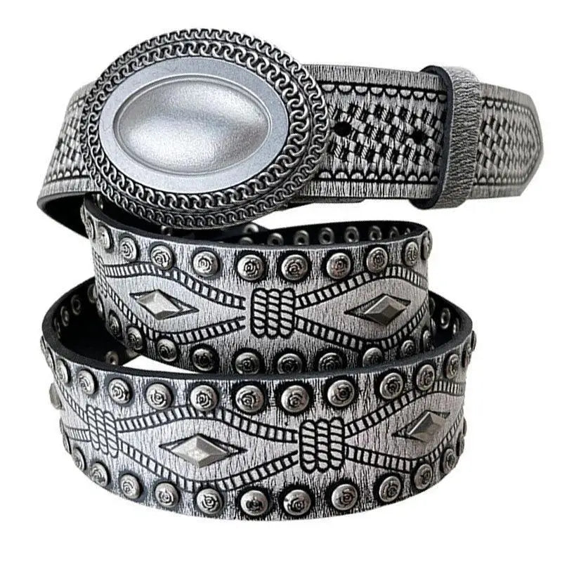 Silver western-style tiwa belt featuring studded leather and oval buckles