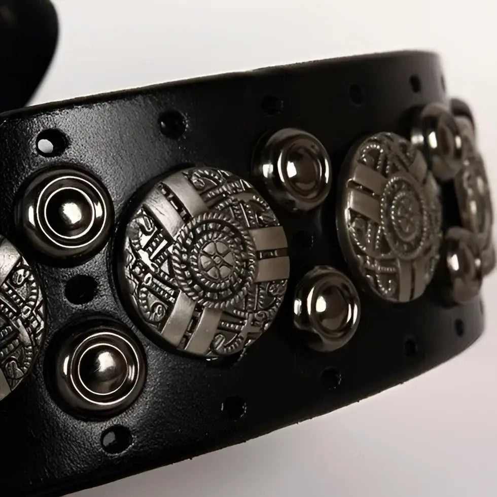Ciradyl belt featuring black leather with silver embellishments and a silver buckle