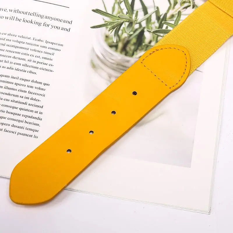 Yellow elastic belt with faux leather ends and silver buckle for casual wear
