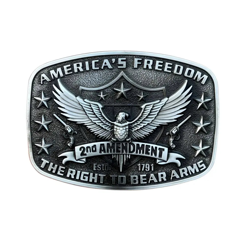 Silver belt buckle featuring an eagle and guns design for western or motorcycle fashion