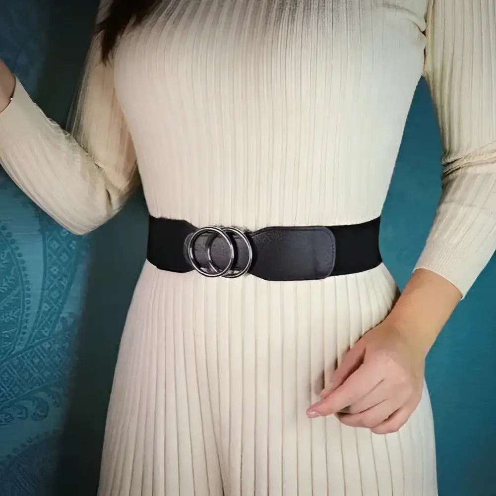 Cream-colored ribbed dress with black belt and gold interlocking circles detail