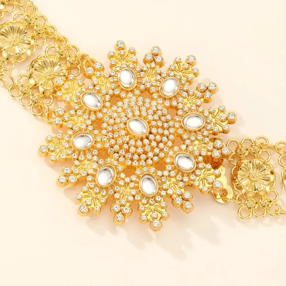 Ornate gold-tone Moroccan belt with jeweled flower design and pearl accents