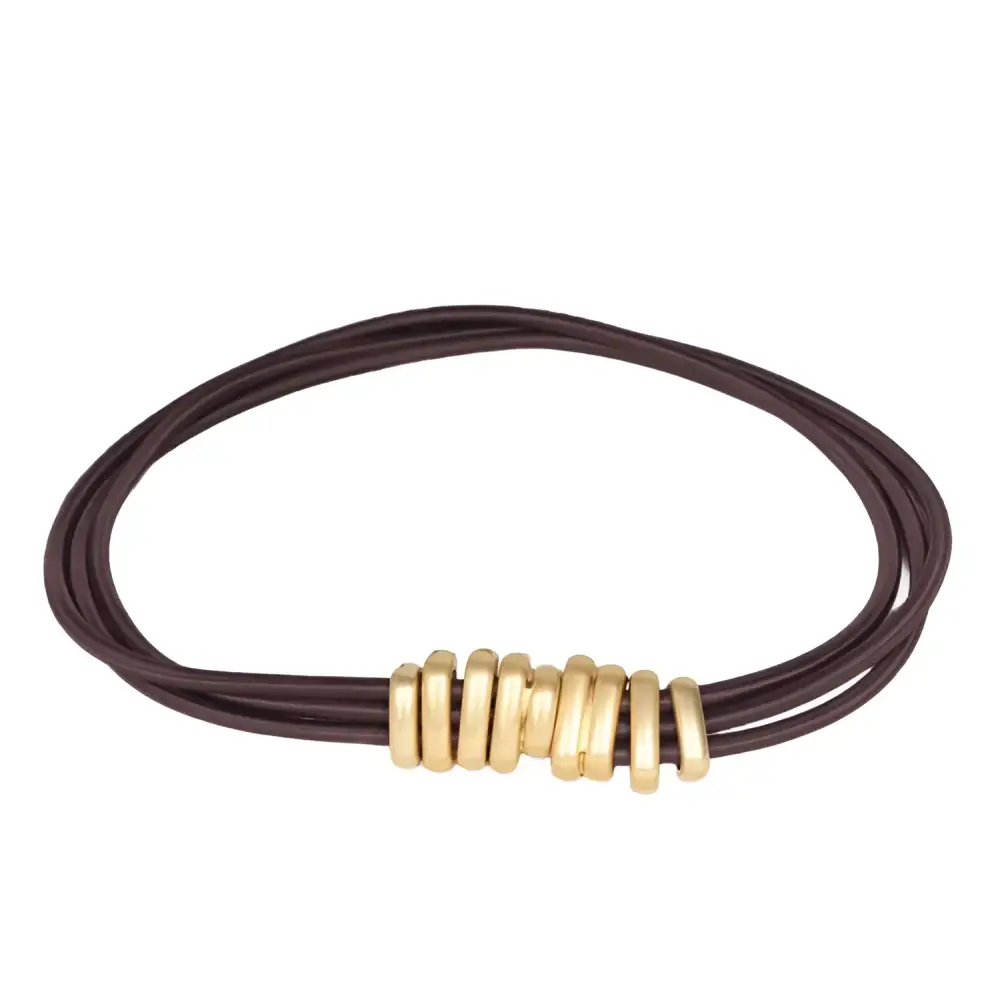 Brown leather bracelet with gold rings complementing the Madona belt for trendy women’s fashion