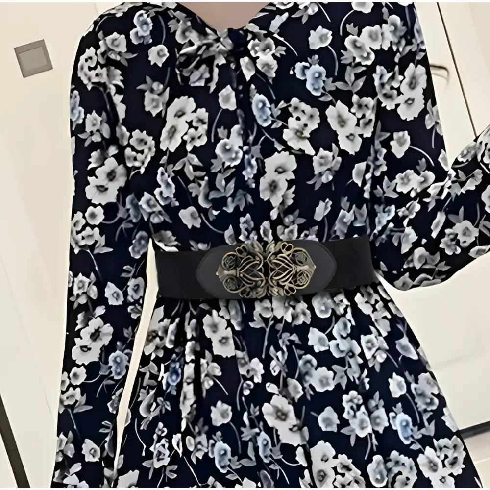 Elegant floral dress with decorative belt and silver clasp for stylish occasions