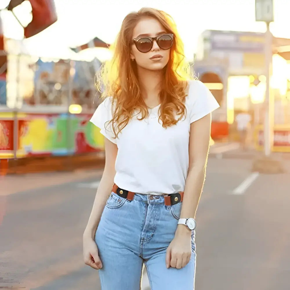 Woman in casual floral dress with beige belt and gold ring buckle