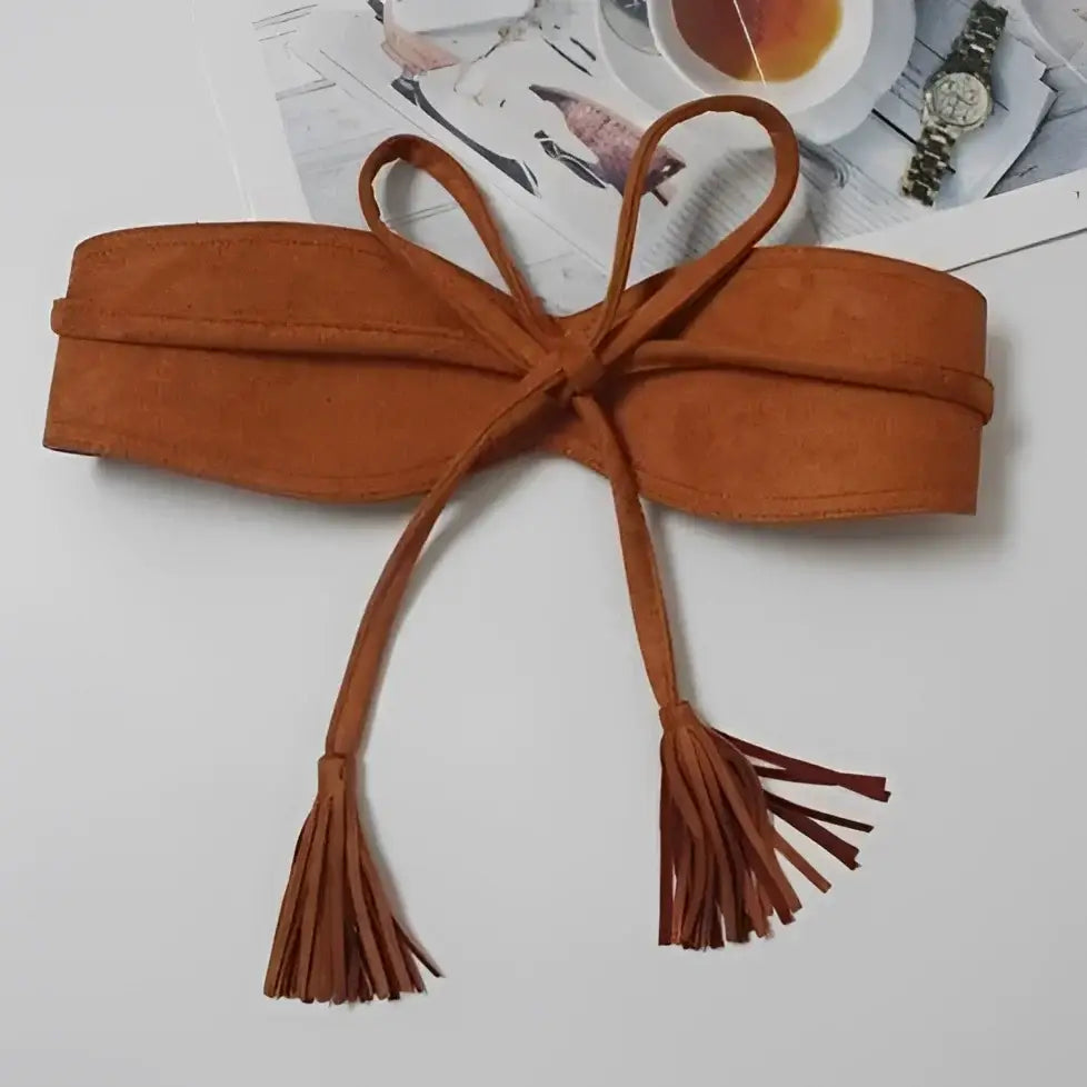 Brown suede tie belt with tassels displayed on Floral Print Dress with Red Sash