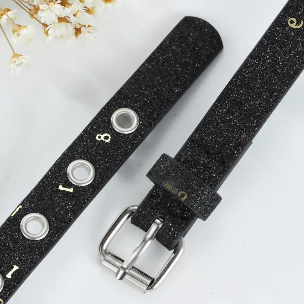Black glittery belt with silver buckle and grommet details in the Glittery Belts collection