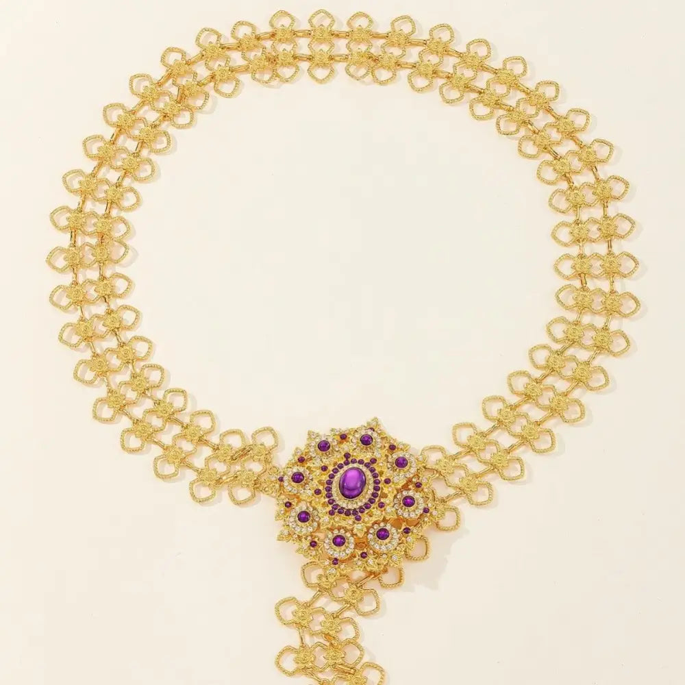 Gold-tone metal belt with purple and clear rhinestones featuring jeweled buckle accessories