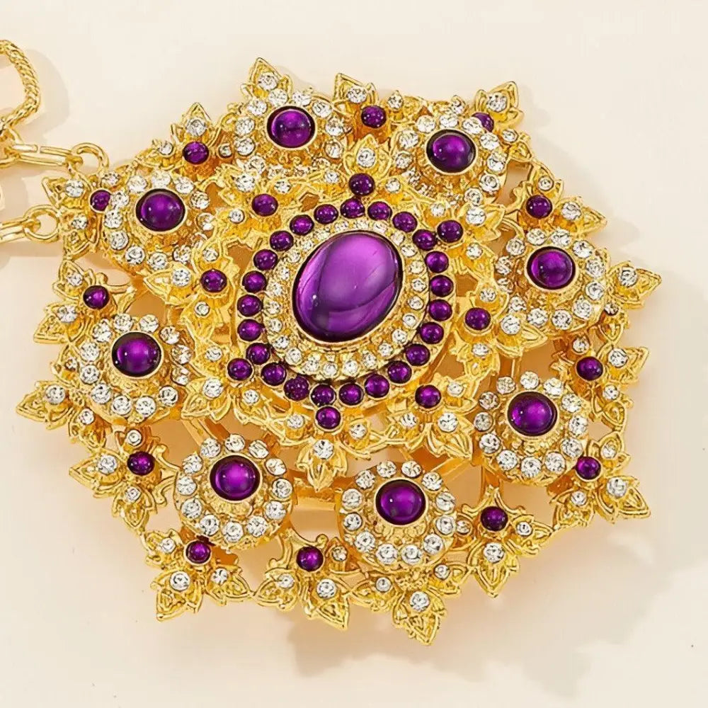 Ornate gold and purple jeweled pendant on a Gold Belt with Jeweled Buckle and Rhinestone Accents