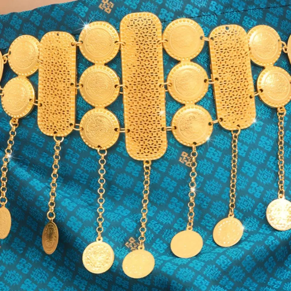 Ornate gold coin belt with dangling pendants from Gold Coin and Bar Mesh Belt collection