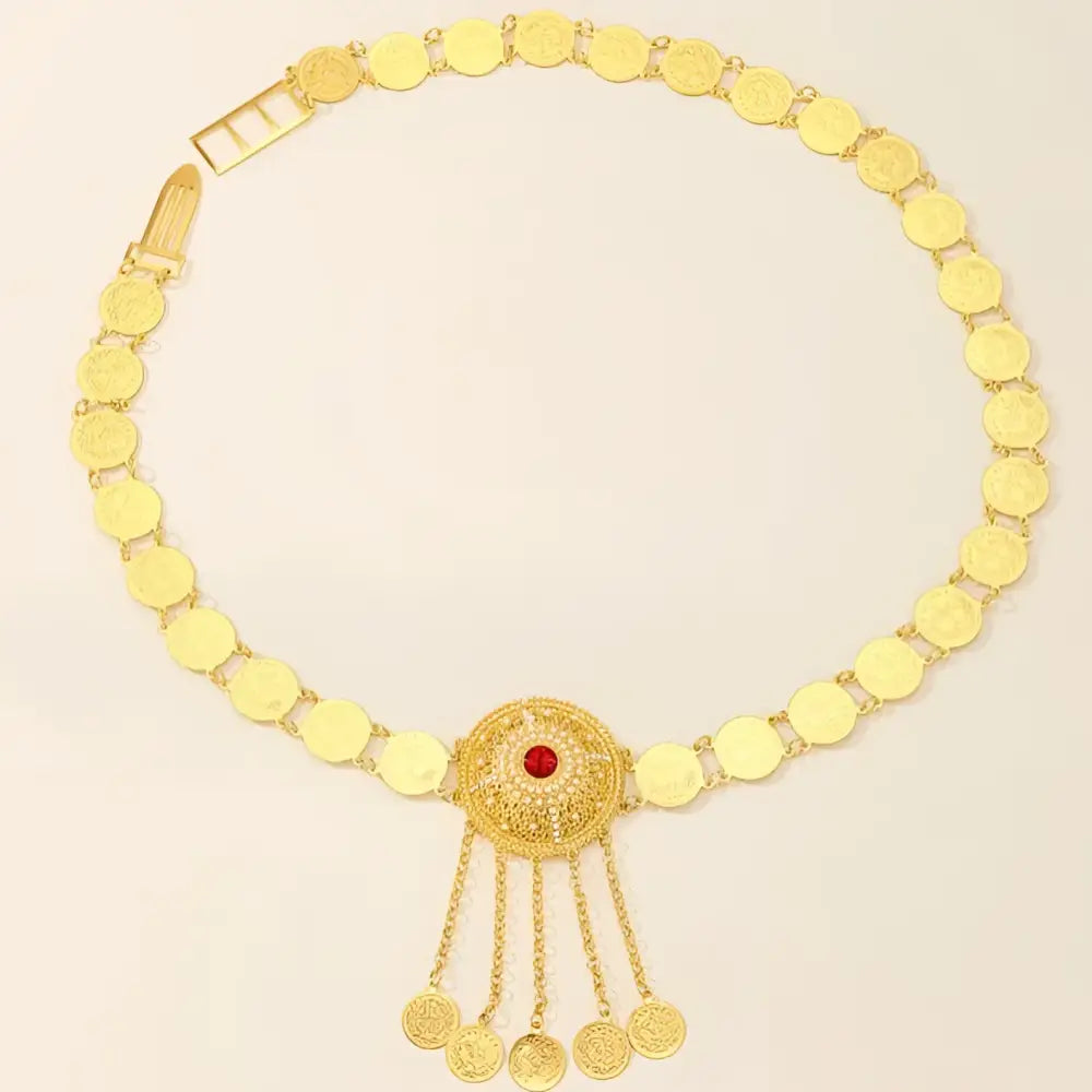 Gold coin belt with medallion and red center in a jewel-accented belly chain