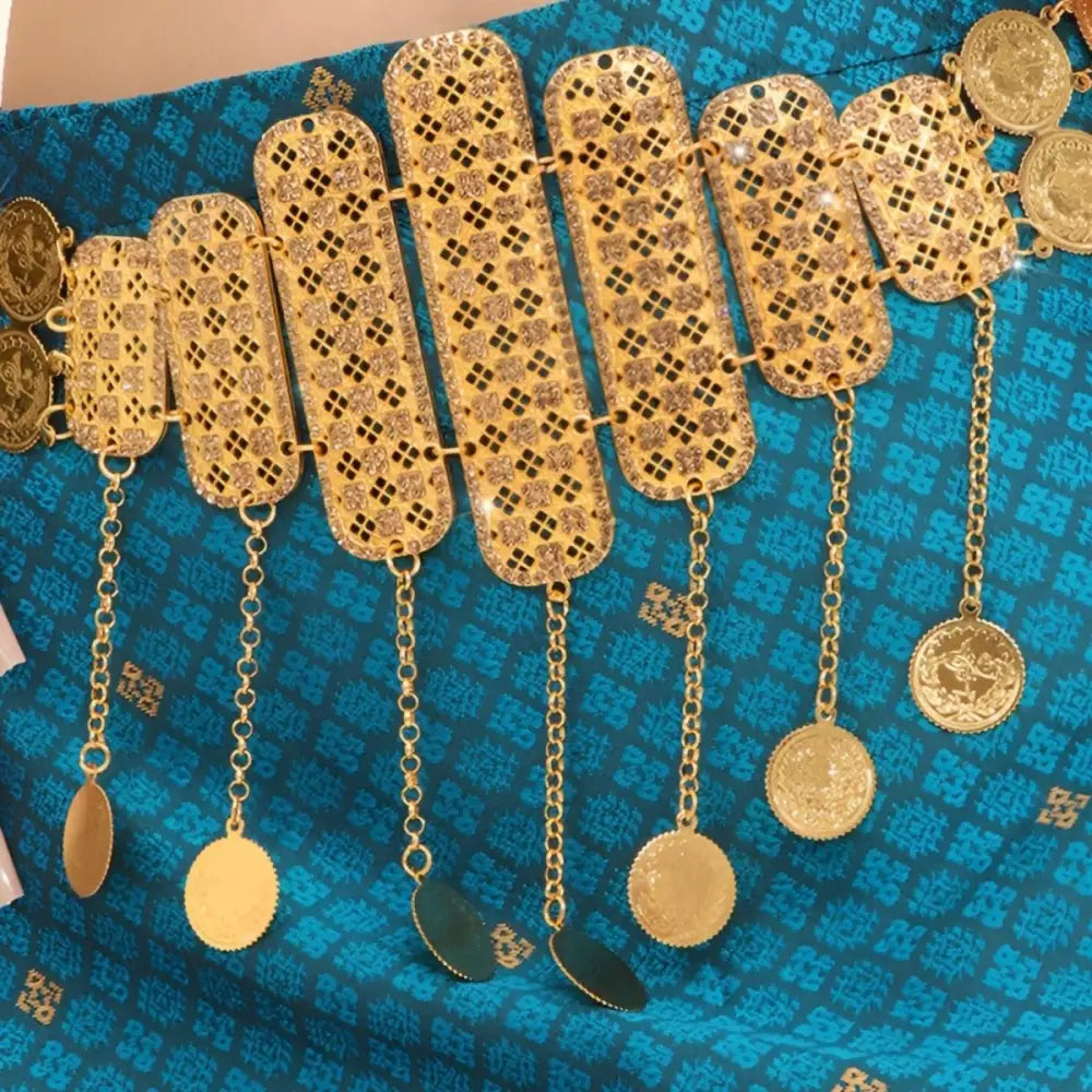 Ornate gold belt with dangling coins and pendants, a traditional Moroccan belt design