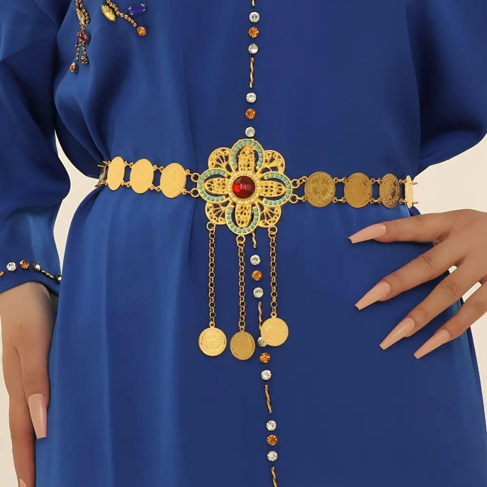 Gold coin belt featuring an elegant floral centerpiece for stylish accessories