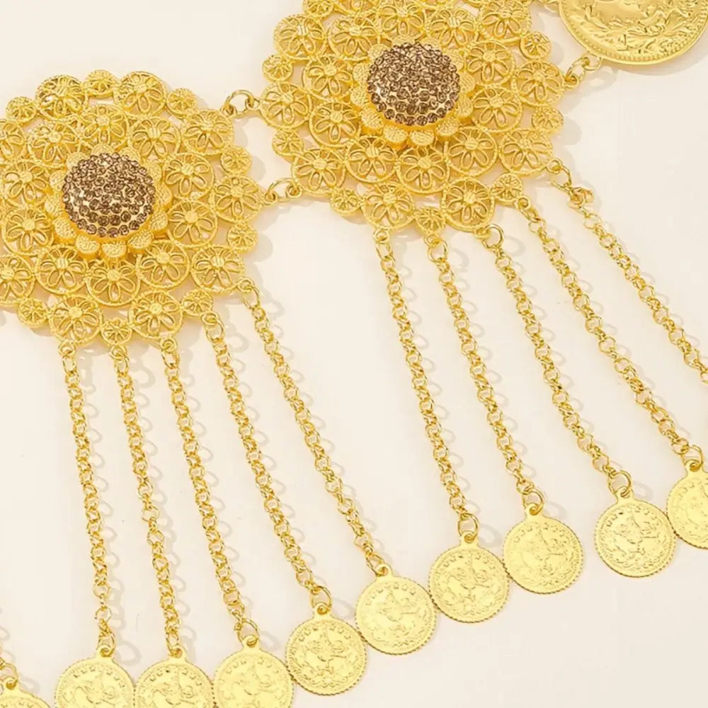 Gold-toned coin-dangling belt with intricate filigree and floral medallions