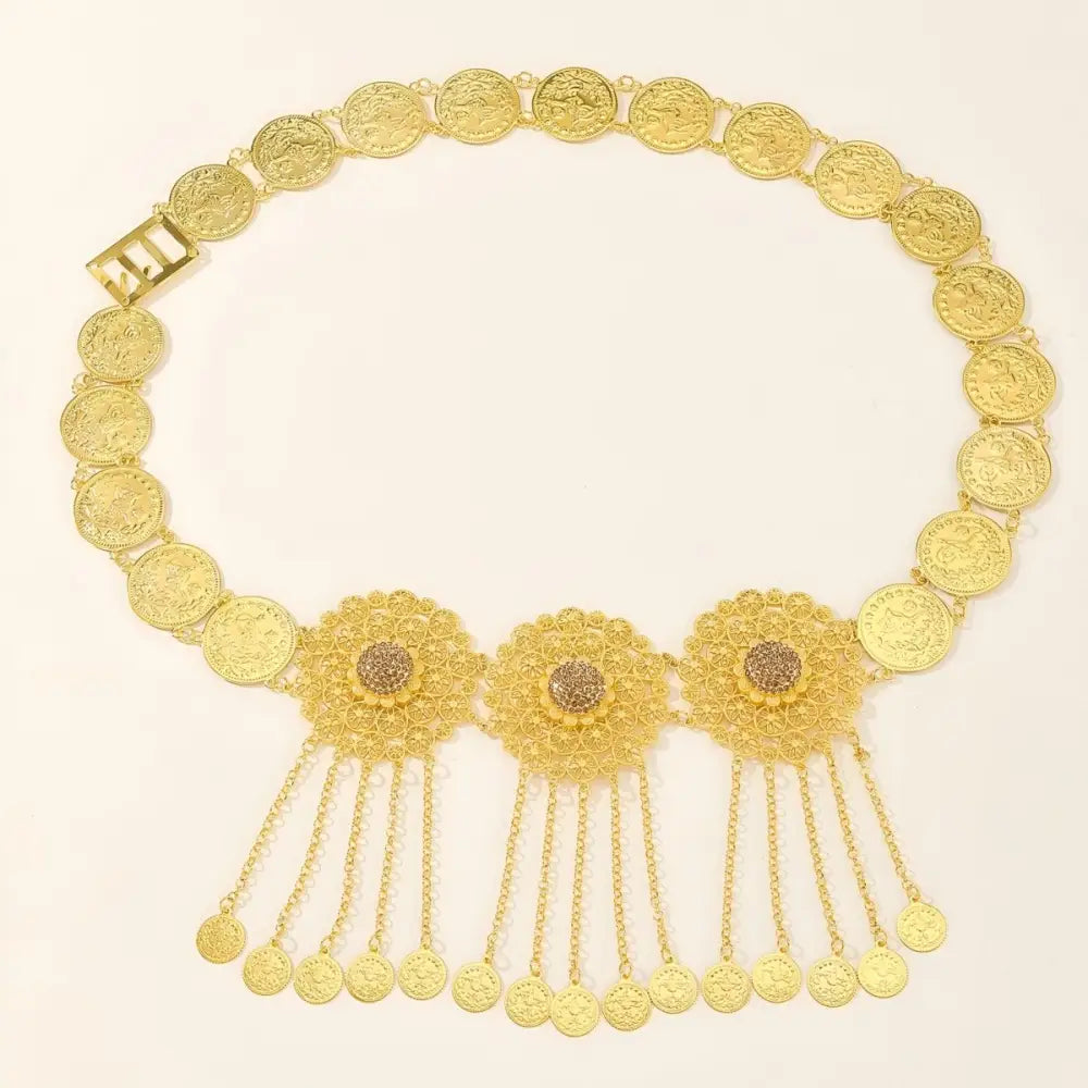 Gold filigree coin and floral medallion belt with dangling coins and intricate details