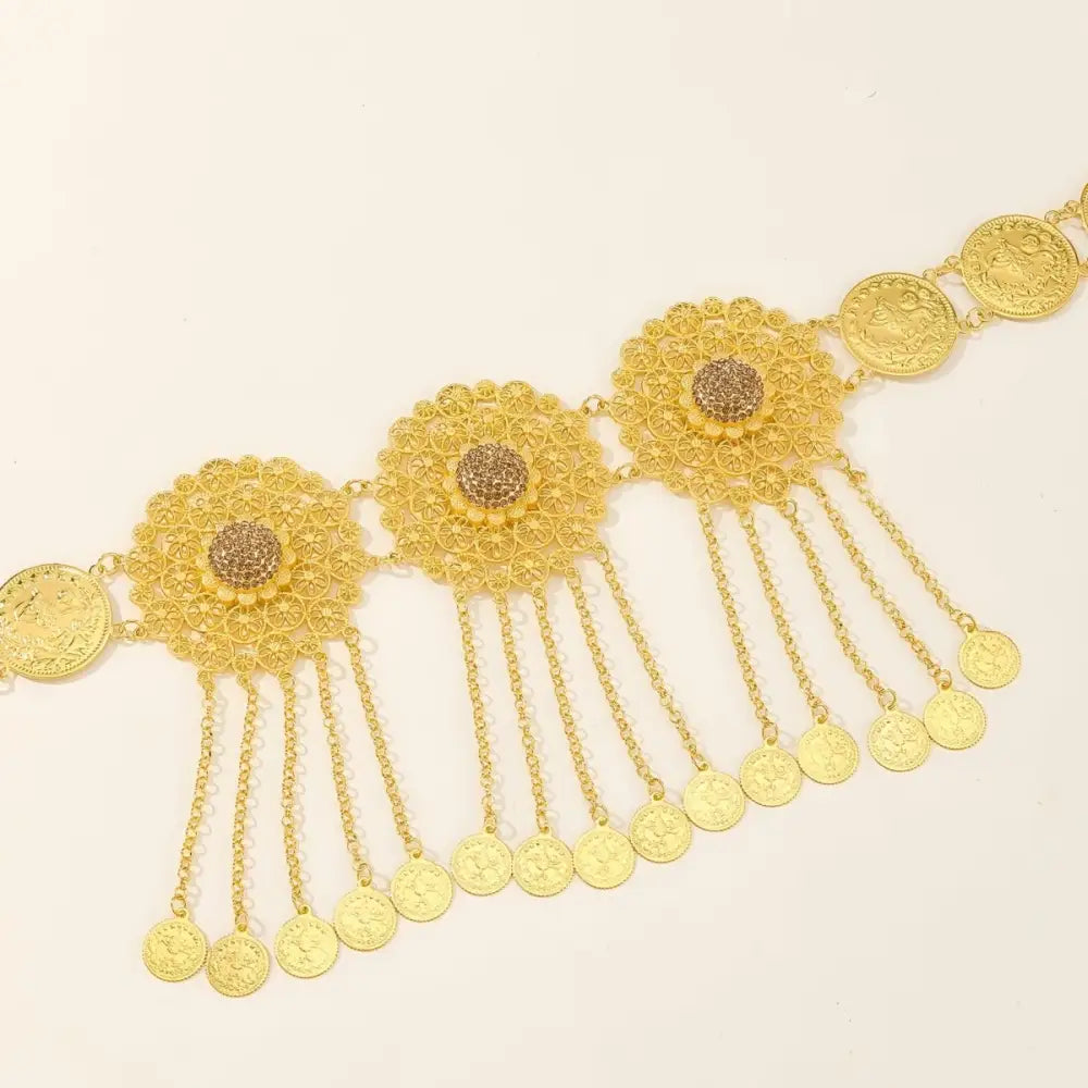 Gold-toned coin and floral filigree medallion belt viewed in the Gold Filigree Coin and Floral Medallion Belt product