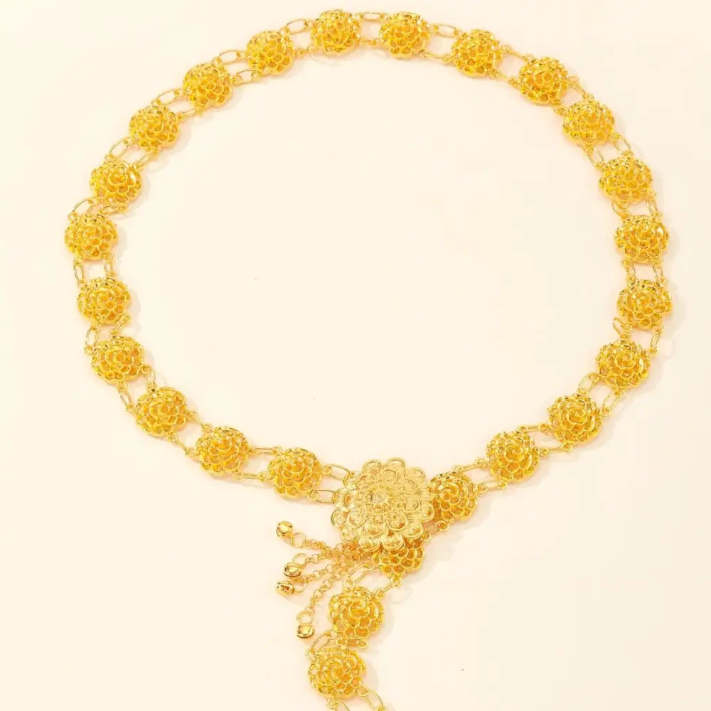 Ornate gold-colored floral waist chain displayed in the Gold Floral Waist Chain product image
