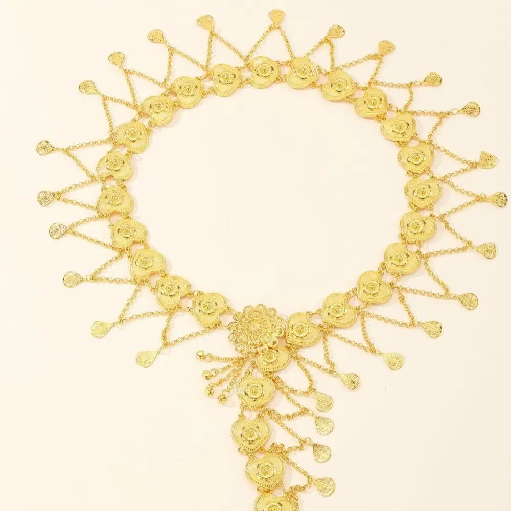 Gold floral-themed belt with dangling chains from Gold Heart and Floral-Shaped Jewelry and Chain Belts