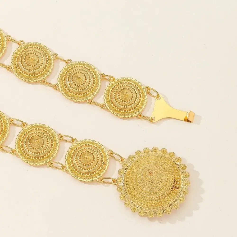 Gold-toned filigree medallion belt displaying intricate Moroccan belt craftsmanship