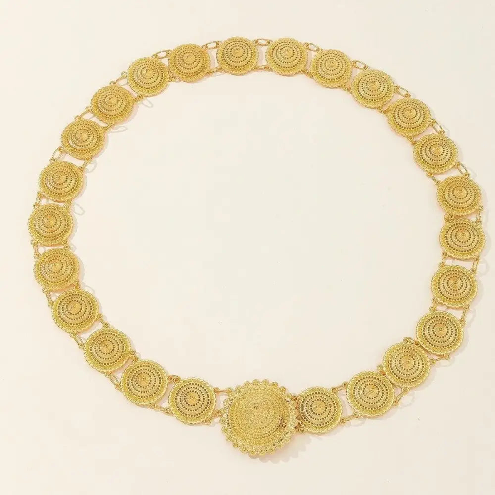 Gold-toned circular link belt with filigree medallion details, perfect as a Moroccan belt