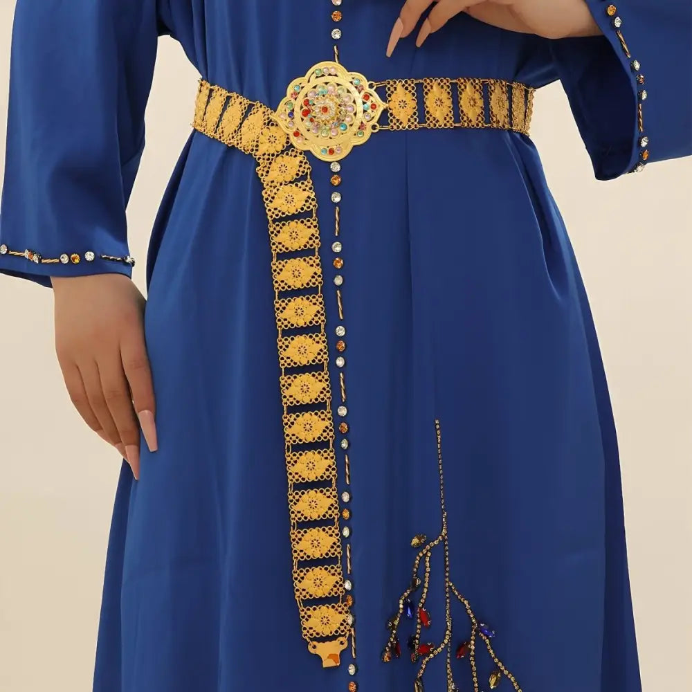 Blue dress with a gold-tone metal belt featuring a jeweled flower buckle