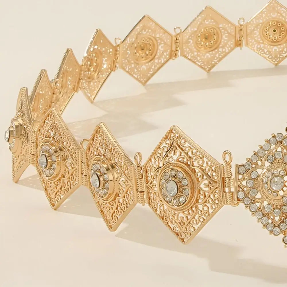 Ornate gold-colored diamond-shaped Moroccan belt with rhinestone embellishments